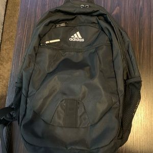 Adidas Black Backpack, lots of pockets and zippers.